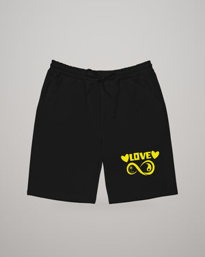 Infinite Love men's fleece shorts in black, yellow print on the leg, front view