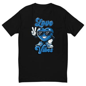 Love Vibes Crew design on a black men's fitted t-shirt, front view